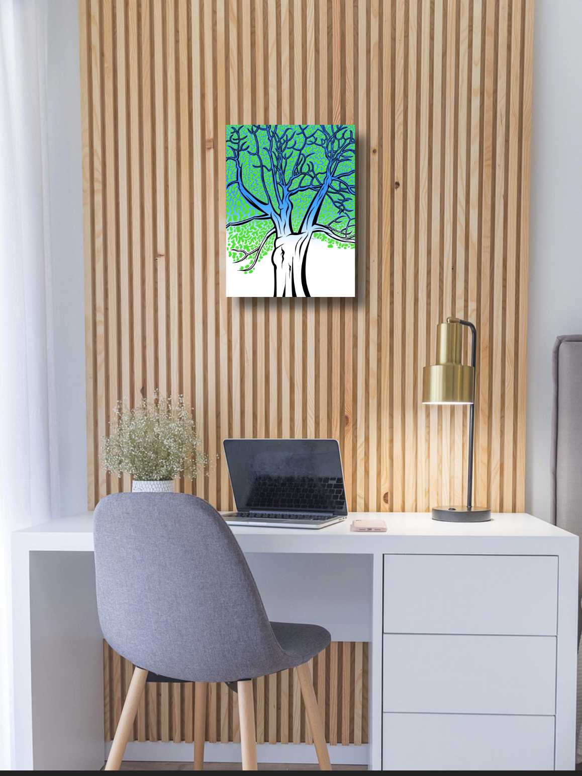 Modern office setup with a desk, chair, laptop, and bright green decorative wall art.