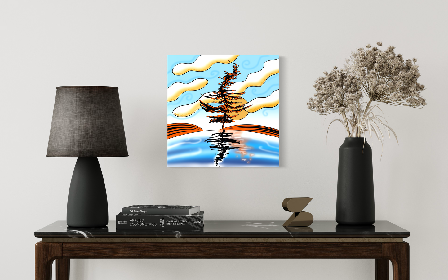 Abstract painting on a wall above a table with a lamp & books in living room.