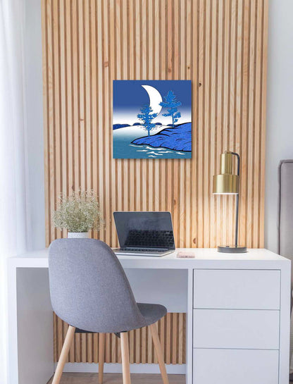 Modern office setup with a desk, chair, laptop, & decorative stylistic wall art.