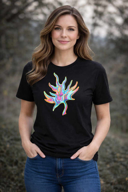 Woman wearing a black t-shirt with a colourful Psychedelic Maple abstract design outdoors.