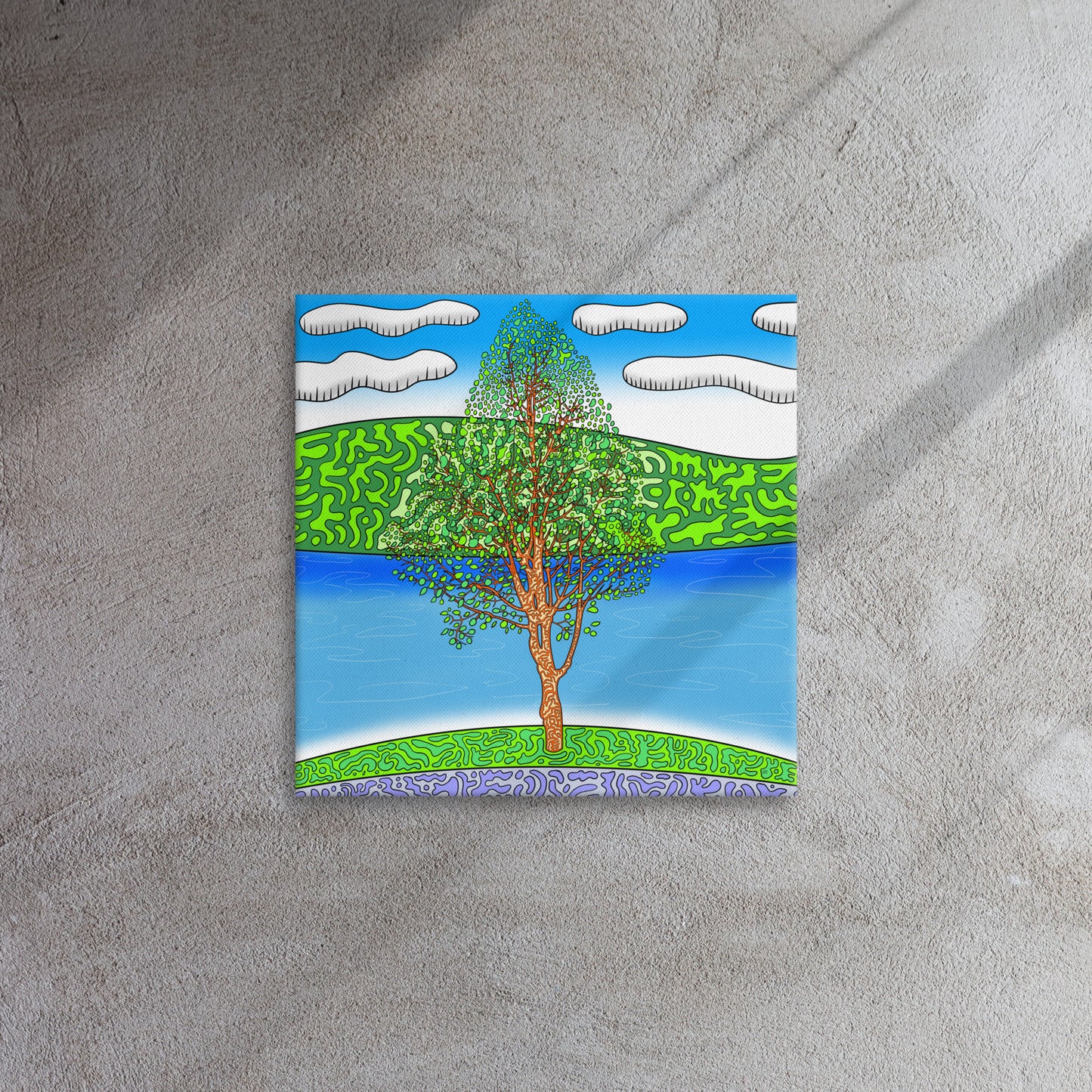 Bright green and bluesquare canvas print on grey wall. 